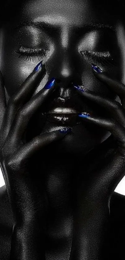 Black artistic portrait with blue highlights on nails.