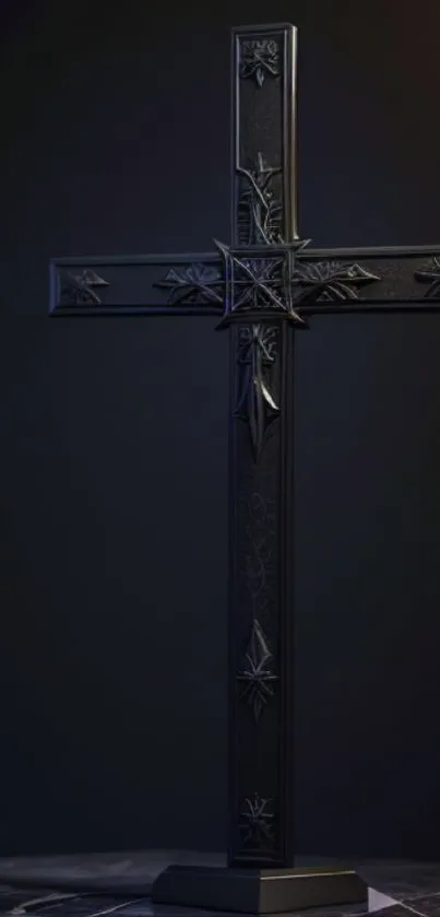 Elegant black cross artwork with intricate design on a dark background.