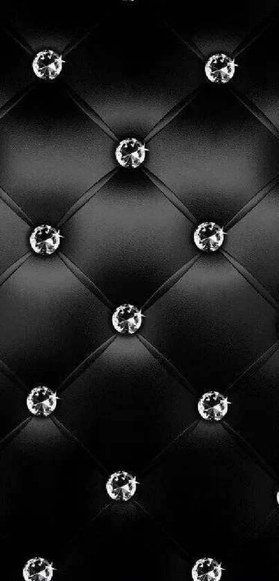 Black quilted wallpaper with diamond accents.