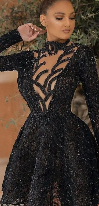 Elegant woman in black lace dress with intricate patterns.