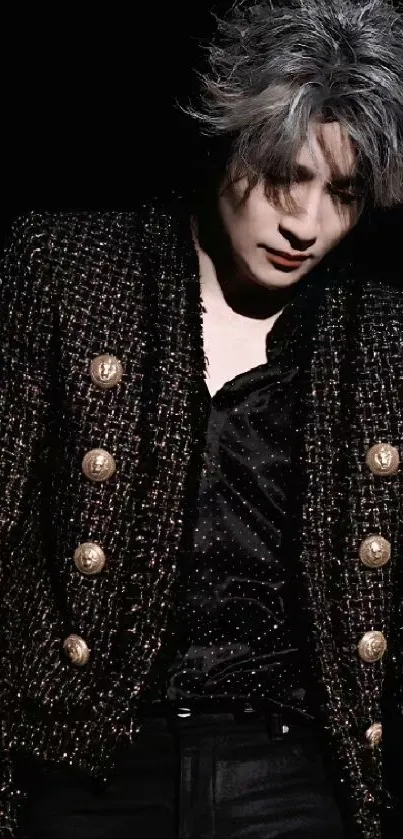 Elegant black jacket with gold buttons on a dark background.