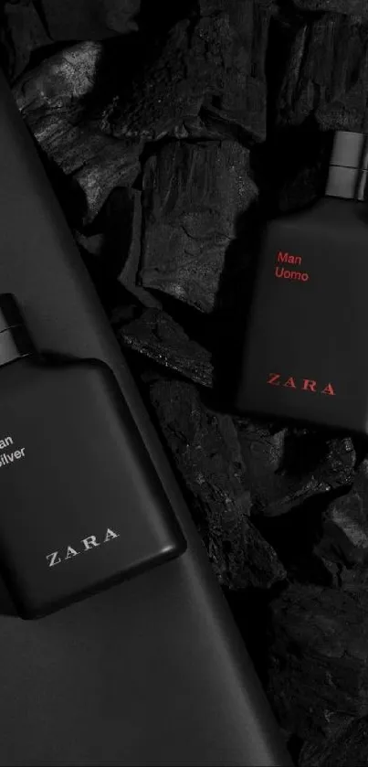 Elegant black fragrance bottles on dark texture.