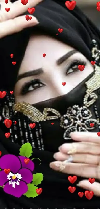 Elegant woman in black hijab with henna and jewelry.