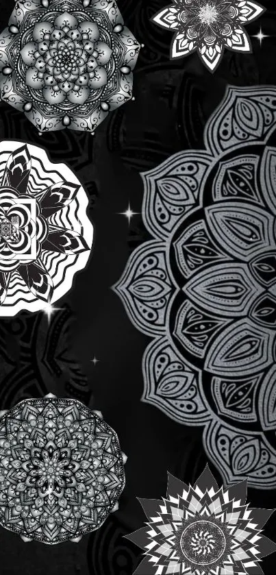 Intricate black and white mandala wallpaper with complex geometric patterns.