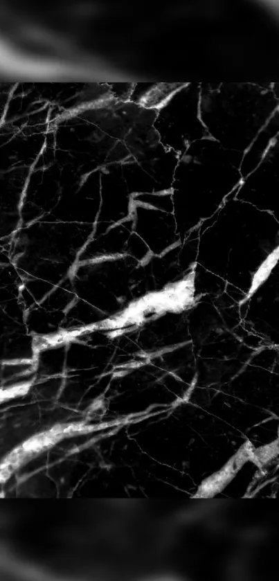 Black marble wallpaper with white veins.