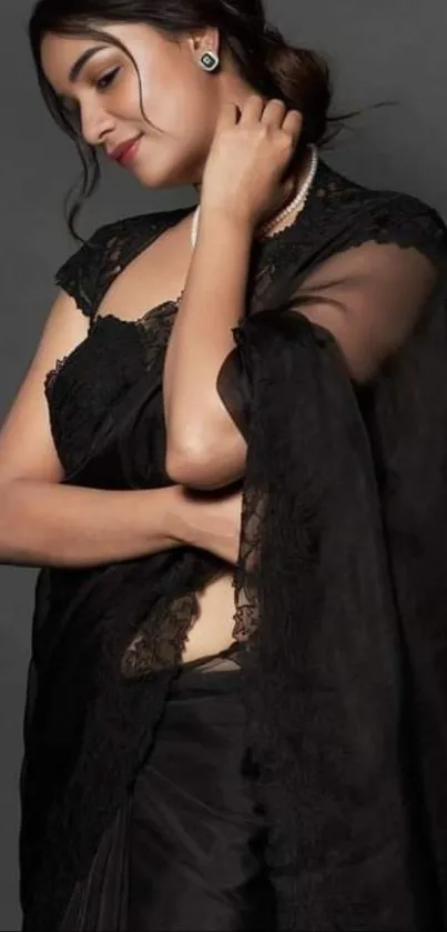 Fashionable woman in a chic black saree.