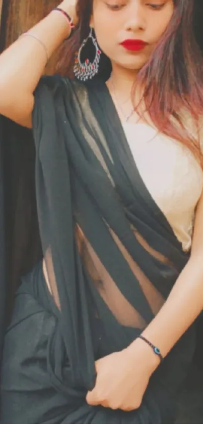 Elegant woman in black sari mobile wallpaper.