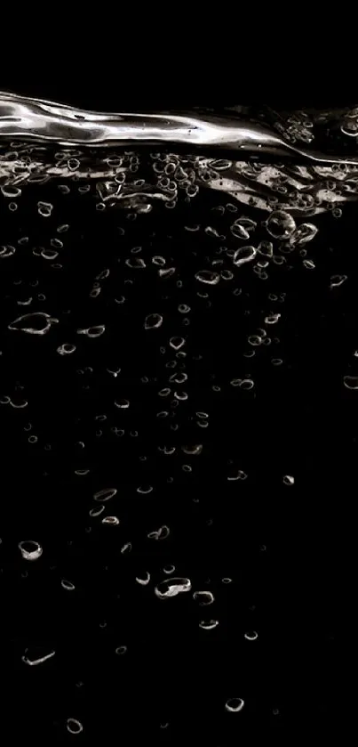 Black wallpaper featuring elegant water bubbles on a dark background.