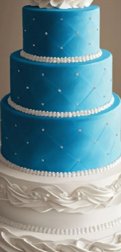 Three-tiered blue and white wedding cake with elegant frosting design.