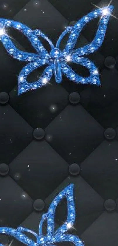 Elegant blue butterfly with a shimmering design on a dark quilted background.