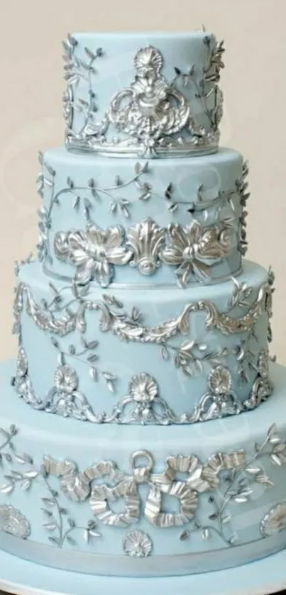 Elegant cake with blue and silver floral designs.