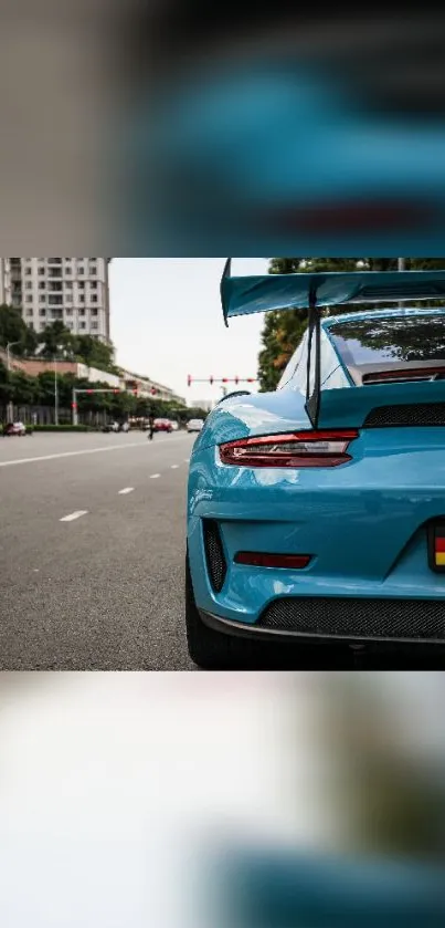 Blue sports car parked on a city street, showcasing modern design and elegance.