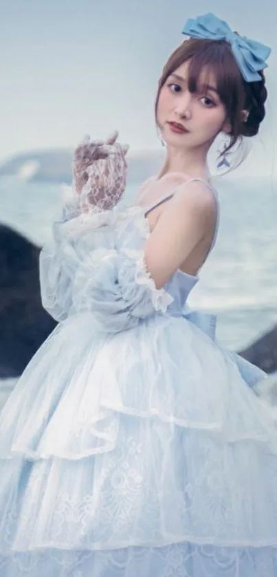 Girl in an elegant white dress by the sea.