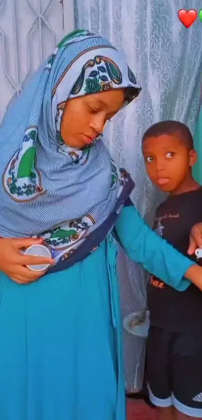 Mother and child in elegant blue attire, a heartwarming family scene.