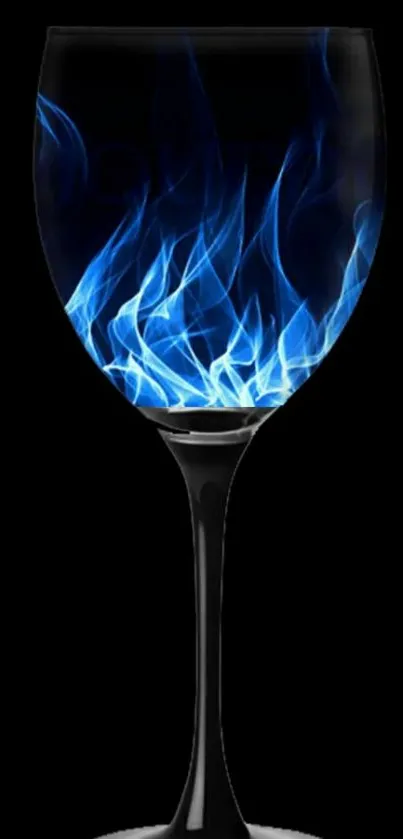 Elegant glass with blue flames on black background.