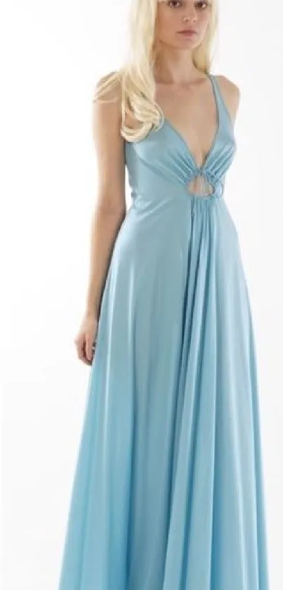 Elegant woman in flowing light blue gown with blond hair.