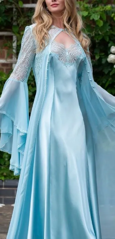 Elegant woman in sky blue gown standing in a garden.