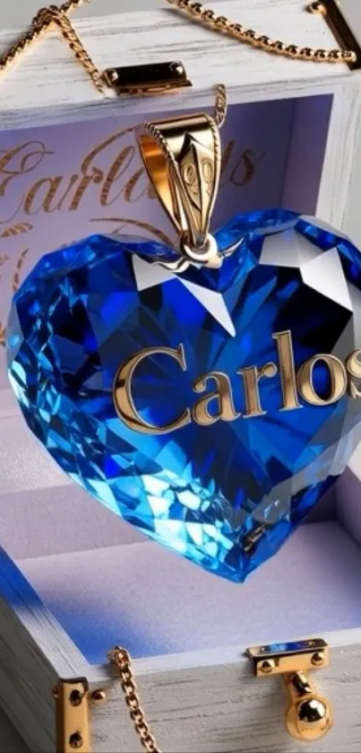 Elegant blue heart crystal pendant with golden lettering in a box.