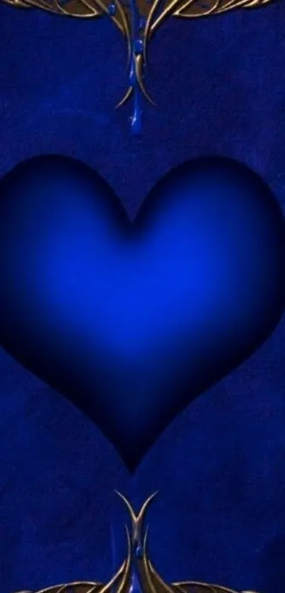 Elegant blue heart with gold ornamented design on dark background.