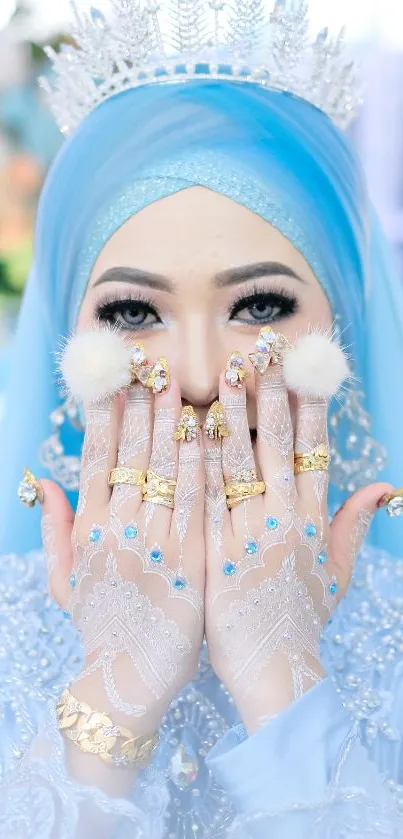 Elegant blue hijab and gold jewelry in a glamorous portrait.