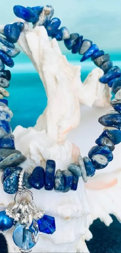 Blue gemstone bracelet on white shell background.