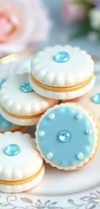 Elegant blue-frosted macarons on a decorative plate.