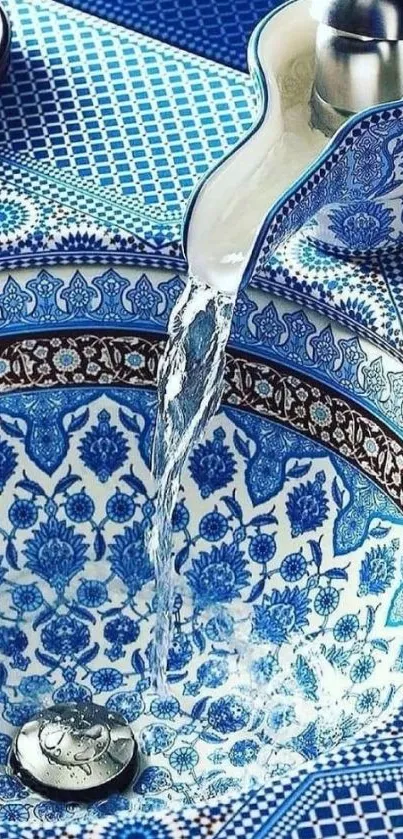 Blue mosaic sink with flowing water and intricate patterns.