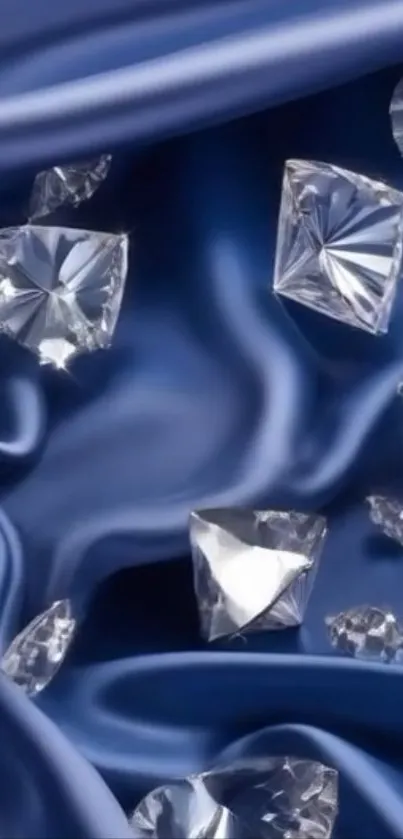 Diamonds on rich blue satin fabric wallpaper.