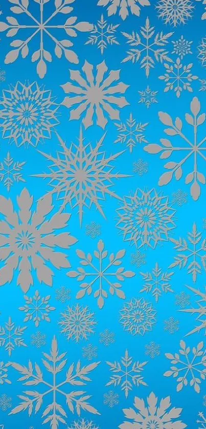 Intricate blue snowflake pattern wallpaper, perfect for winter aesthetics.