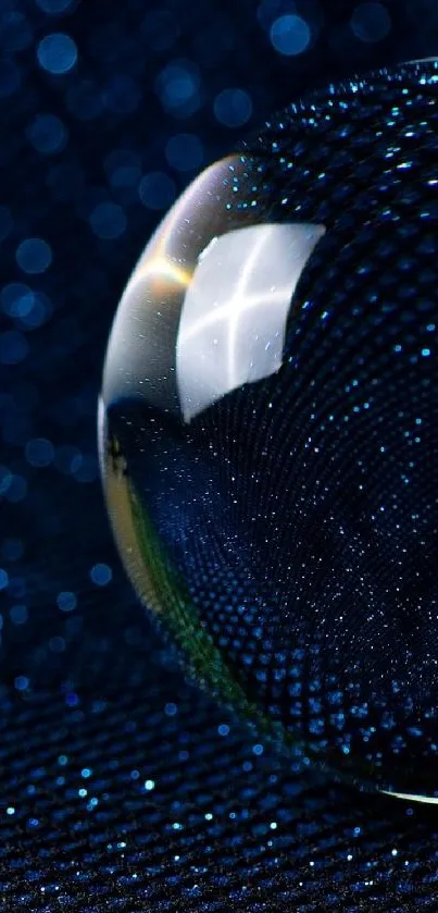 Close-up of a blue sphere with sparkling details and a dark background.