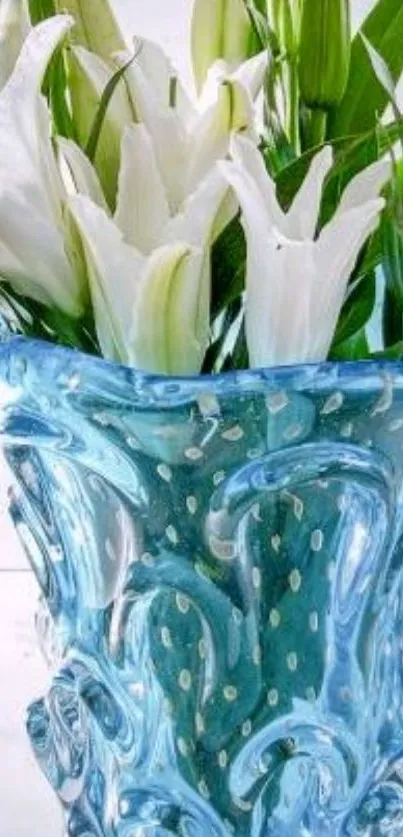 Artistic blue vase with white lilies and green leaves in vivid detail.