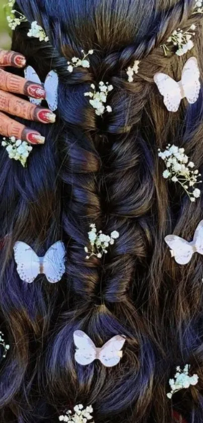 Intricate braid with white butterflies in dark hair.