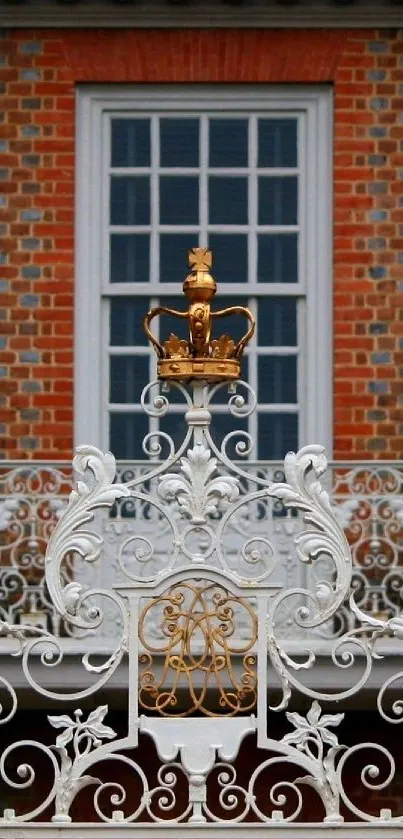Regal statues and intricate ironwork against a brick wall with blue windows.