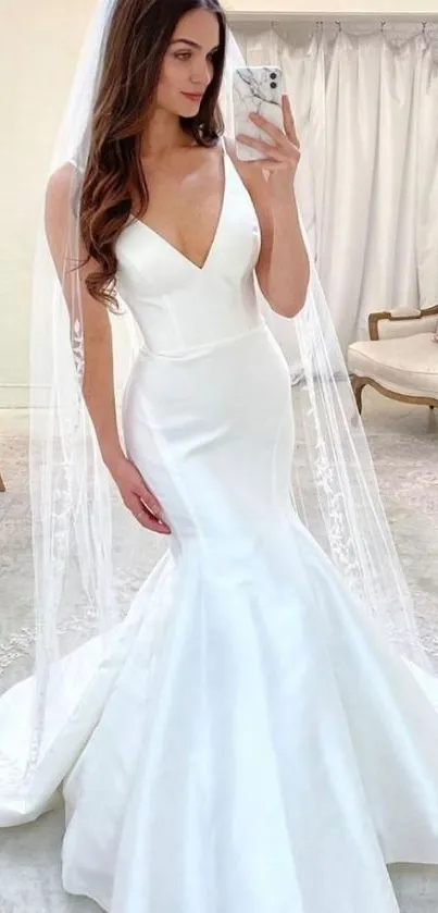 Elegant bridal gown mobile wallpaper with a beautiful white dress.