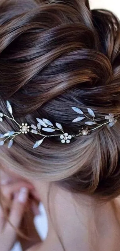 Elegant updo with floral hair accessory.