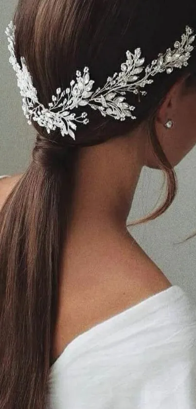 Elegant hairstyle with white ornamental accessory.