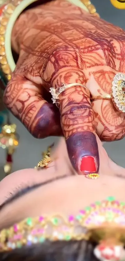 Bride's hand with henna and jewelry in a close-up elegant portrait.