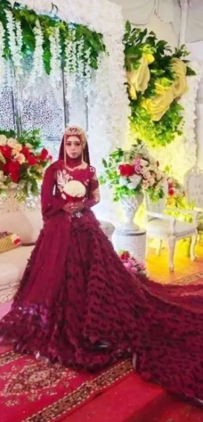 Bride in maroon gown with floral decor and elegant wedding setting.