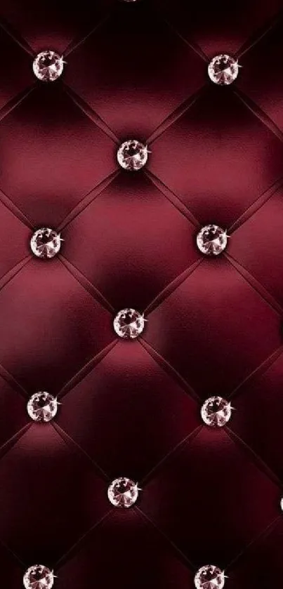 Burgundy quilted wallpaper with diamond accents.