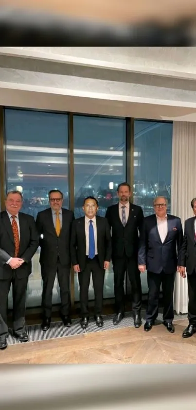 Group of business professionals in suits in front of a city view window.