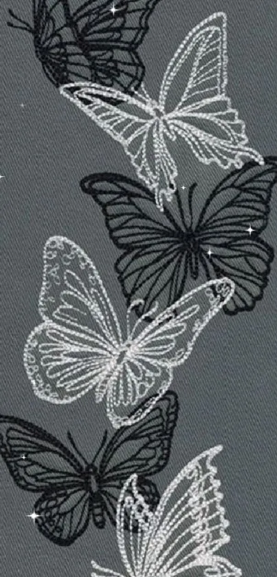 Gray wallpaper featuring black and white butterflies.