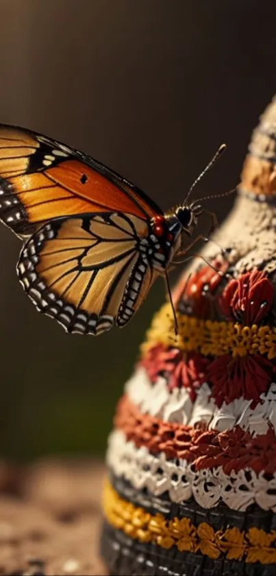 A butterfly rests on a colorful, woven pottery piece.
