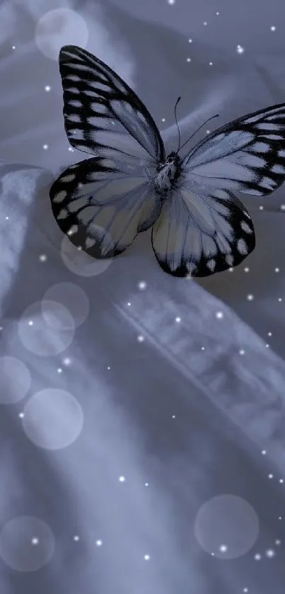 Elegant butterfly resting on soft white fabric in a serene image.