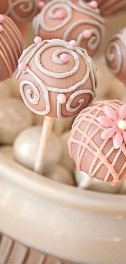 Elegant cake pop wallpaper with pink and brown swirls.