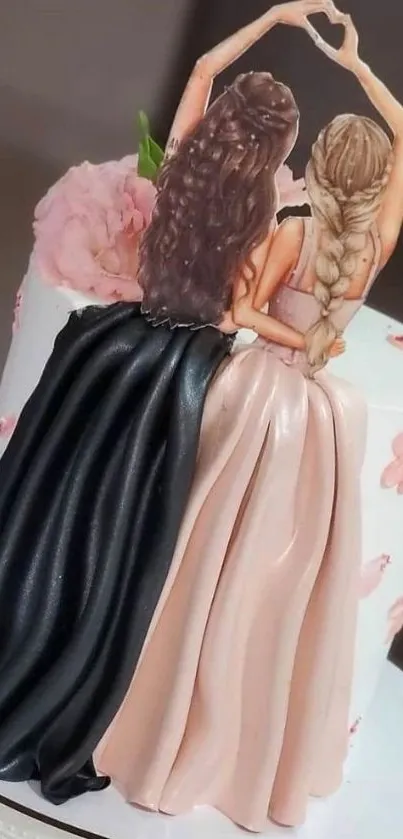 Elegant cake topper featuring two friends in detailed dresses.