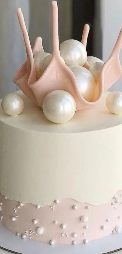 Elegant cake with pink décor and pearls.