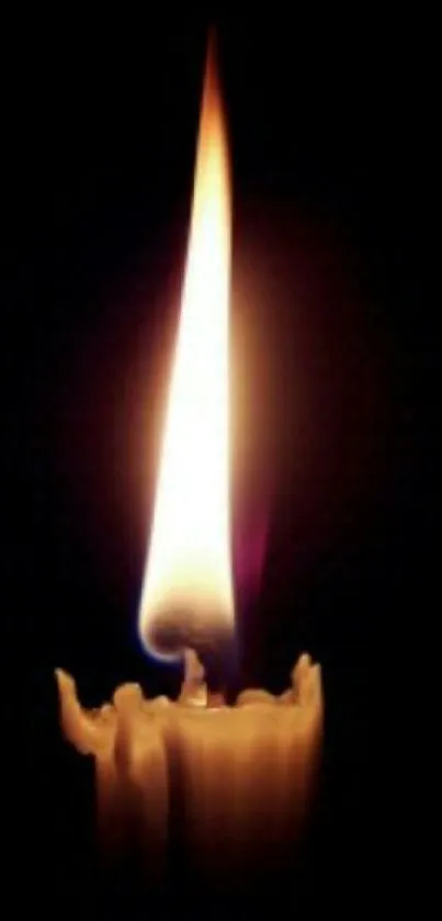 Mobile wallpaper of a glowing candle flame on black background.