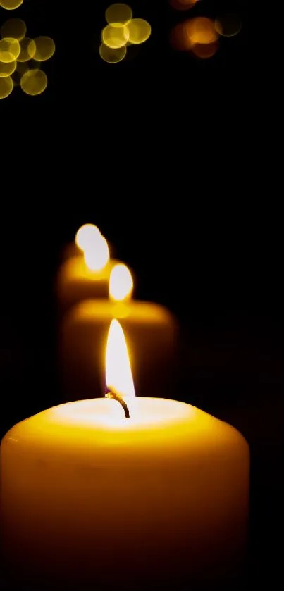 Soft-focus candlelight creating a warm glow on a dark background.