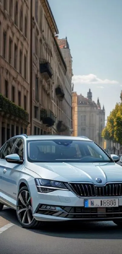 Elegant car on city street wallpaper, showcasing sleek design and urban architecture.