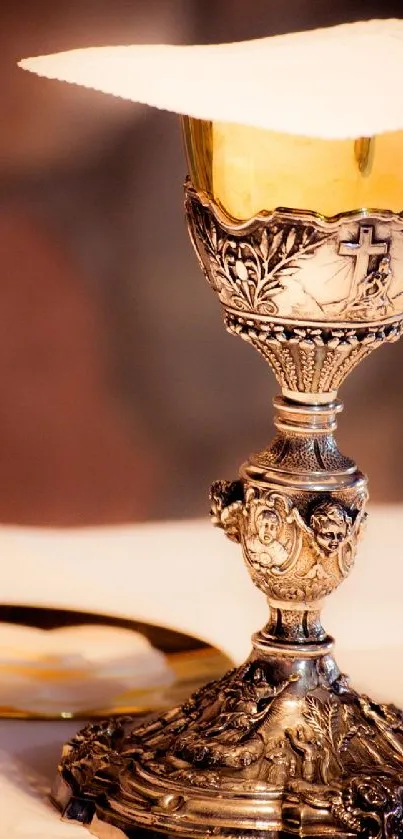 Elegant chalice with wafers on altar.